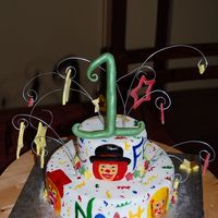 Clowns And Stars crunchy triple chocolate cake filled with caramelized pecans crumbcoated in chocolate buttercream covered with fondantClowns are hand...