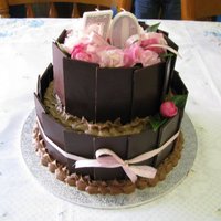 70Th Birthday Cake 2 tier, chocolate sponge layered x3 with chocolate mousse in between each layer. Each layer was moistened with strong coffee &...