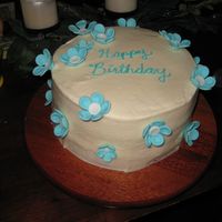 Fondant Flower Birthday Cake Iced in buttercream with all fondant flowers.