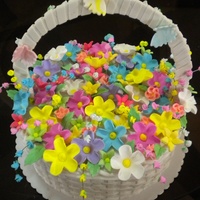 Basket Of Flowers Cake Basket weave is handmade and hang-woven out of fondant. Flowers are sugar flowers and butterflies are made out of gum paste. Thanks for...