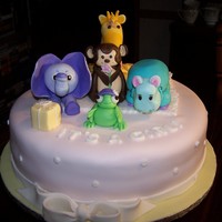 Its A Girl Vanilla cake, fudgy chocolate cake with buttercream and chocolate ganache filling. Covered in fondant with baby animals for the top.