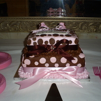 Pink & Brown Baby Shower Cake BC icing W/fondant dot's & satin ribbion.The baby shoe's are made out of Gum paste.