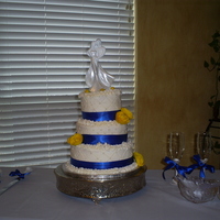 Blur & Gold Wedding Cake. BC icing w/blue ribbion and satin flowers