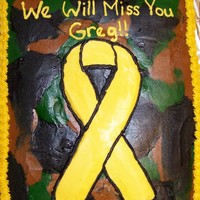 Yellow Ribbon With Camo Background Yellow cake decorated in buttercream.