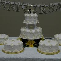 Harris' 50Th Anniversary White cake, white buttercreamicing, royal icing roses dusted with gold glitter. Old photo I ran across and thought I would post my first...