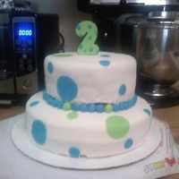 Daniels 2Nd Bday cake i made for my nephew top was chocolate bottom was confetti covered with mmf not my best work was trim the fondant while holding my 14...