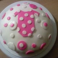 Baby Onesie I made this cake for a baby shower its a banana nut cake with buttercream frosting and coverered in marshmellow fondant
