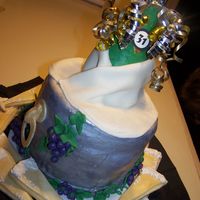 Champagne Bottle Cake The bottle is chocolate, with a fondant-covered cake and matching champagne flute cookies