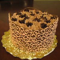 Lauren Scrolls This is a birthday cake for a friend of mine who is pregnant and is a chocolate fanatic right now. It is a chocolate cake filled with...