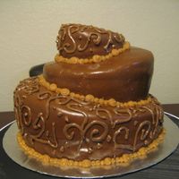 1St Topsy Turvy this is a vanilla cake filled with chocolate mousse. It was my first time using fondant as well as making a topsy turvy. Though i nedd a...