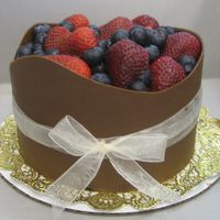 My_Cakes_005.jpg This is a chocolate torted cake filled with chocolate mousse. I wrapped it in chocolate and topped it off with fresh berries. Hope you guys...