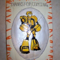 Transformer Cake Transformer Bumblebee? birthday cake for a 6-year-old boy. Chocolate and vanilla cake, buttercream icing. The oval "plaque" with...