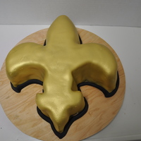 Oh The Saints Go Marching In quick cake done for a saints fan, gold air brushed fondant and black fondant accent.... not my best work