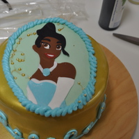 Princess And The Frog - Tiana Portrait I was less then thrilled with this cake, especially since the portrait had turned out SOOOO well....but ehhh...the portrait on the cake was...