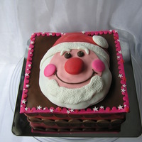 Happy Santa This cake I made for our Christmas diner, it was filled with raspberries and cream en covered in rolled chocolate and marzipan...Delicious...