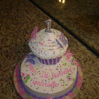 Butterfly Cake 3D cupcake with RI butterflies, bc icing with pink fondant accents on cupcake.