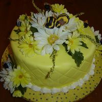 Baby Bumblebee Baby bumblebee cake with silk flowers. Chocopan fondant. Wilton's sleeping angel baby covered in gumpaste to look like a baby bumble...