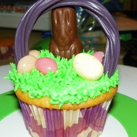 Easter Basket Cupcake Easter basket cupcakes. I actually made 50 of these and I used rainbow Twizzlers for the handles so I had many different color handles,...