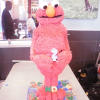 Elmo chocolate cake with cherry filling and italian buttercream frosting. Head, arms and legs of RKT. I made the RKT a little too chewy (my...
