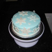 Snowflake Cake Fondant snowflakes made by my 7 yr old daughter, on a fondant covered cake.