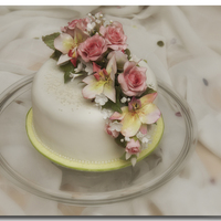 Flower Bouquet wired roses, orchids and small blossoms on this cake
