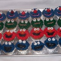 Elmo And Friends Cupcakes For my baby's 1st birthday to share at preschoolall BC with Marshmellow eyes and dum dum pops for noses