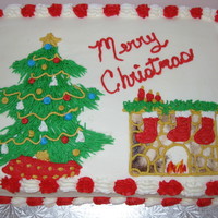 Christmas Tree And Fireplace Cake white almond cake filled with strawberry with buttercream icing.