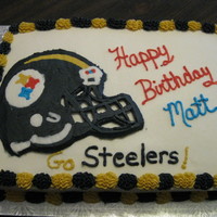 Steelers Helmet White almond cake with buttercream icing.