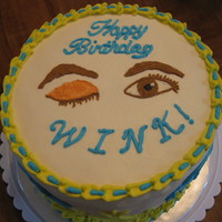 Wink's Birthday Cake White vanilla cake filled with strawberry with vanilla buttercream icing. The person's nickname is Wink so made a winking eye and open...