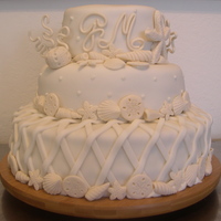 Beach Wedding Cake Vanilla cake with dulce de leche and crushed walnuts filling. Gumpaste accents covered in fondant