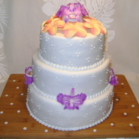 Hawaii Wedding Cake My second wedding cake. Bottom and top tier vanilla and middle tier chocolate, all filled with ganache. Covered in fondant, RI piping and...