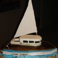 Seal Boat Chocolate germain cake, nut coconut filling, fondant covered, gum paste details, 99% edible (only the dowel is not). This cake was made for...
