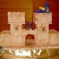 Castle And Dragon I made this cake for a medieval wedding. The cake was huge, the dimensions were 40"x24" and 20" high. It was almost 100%...