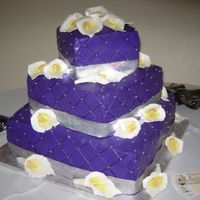 Purrple Passion 3 tiers cake. Buttercream, chocolate cake, lemon cake with raspberry filling. gum paste flowers. The color match the decoration of the...