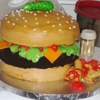 Cheeseburger In Paradise my first crack at a burger... I made this for my fathers b-day as requested... all buttercream except for lettuce, cheese, tomatoes and...