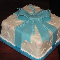 A Birthday Present For You This is a cake I made for my Wilton course 3 and was my first time covering a cake in fondant.