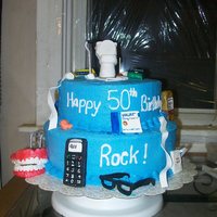 After 50 Everthing Turns To Crap 50th birthday cake. Everything is edible. Cake is frosted in butter cream. Everthing else is made out of gumpaste and hand painted with...