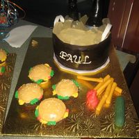 Beer & Burgers Beer cooler cake and burger cupcakes. Beer bottles were made out of sugar. The bottles did not come out that good, it was my first try so I...