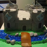 Castle Cake This is a castle Cake I made for a school dance, the theme was Royalty. It was all fondant, water was piping gel. It was my first castle...