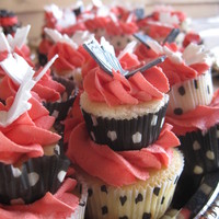 Two-Tier Butterfly Cupcakes These cupcakes were to compliment a three tiered graduation cake. The butterflies are made of fondant and created with the PME cutter/...