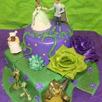 Princess & The Frog 6" round atop an 8" square. Dark Chocolate fudge with raspberry creme filling.*Yellow dots are supposed to look like fireflies* (...