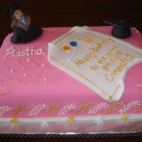 Recently Graduated Bday Girl Cake Birthday cake for a recent graduate. She got a gold medal and hence the gold scroll work on the sides and on the degree certificate....