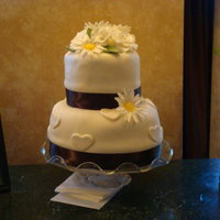 Rose And Daisy Wedding Cake My first wedding cake. It was hot and the whole thing started to tilt and the fondant began to buckle, but they loved it.