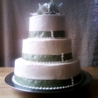 Calla Lily Green And White Wedding Cake This is a WASC cake 12/9/6, with buttercream. Real ribbon and fondant calla lillies. Thanks for looking!