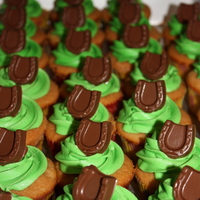 Horseshoe Cupcakes Vanilla cake/vanilla buttercream....Chocolate horseshoe made with a candy mold. I was going to make a red rose to also go on top but ran...