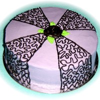 Purple And Black Birthday Cake A 9 in round marble cake, 2 layers, with lemon curd filling. All done in buttercream. The black cornelli is chocolate buttercream tinted...