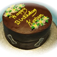 Daisies & Dogs An all buttercream chocolate cake with strawberry filling, covered in chocolate buttercream. The birthday girl loved daisies and her dog. I...