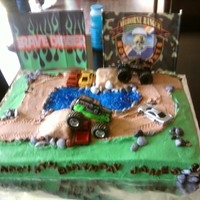 Monster Trucks I did this cake for my grandson's 5th birthday. He wanted monster trucks, dirt and water on it. The trucks I purchased and they came...