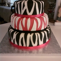 Zebra Print Wedding Cake wasc cake with raspberry filling covered in fondant. This was my first wedding cake for a paying customer. She loves zebra print. It was...