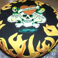 Ed Hardy I did this Ed Hardy cake for a friend's husband. Vanilla cake with strawberry cream cheese filling covered in fondant.